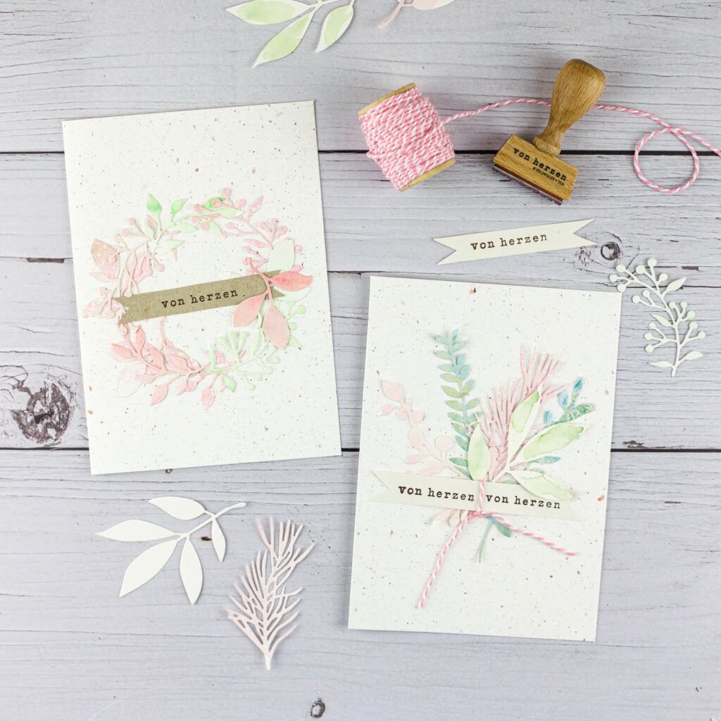 Grusskarte mit ausgestanzten Papierblättern