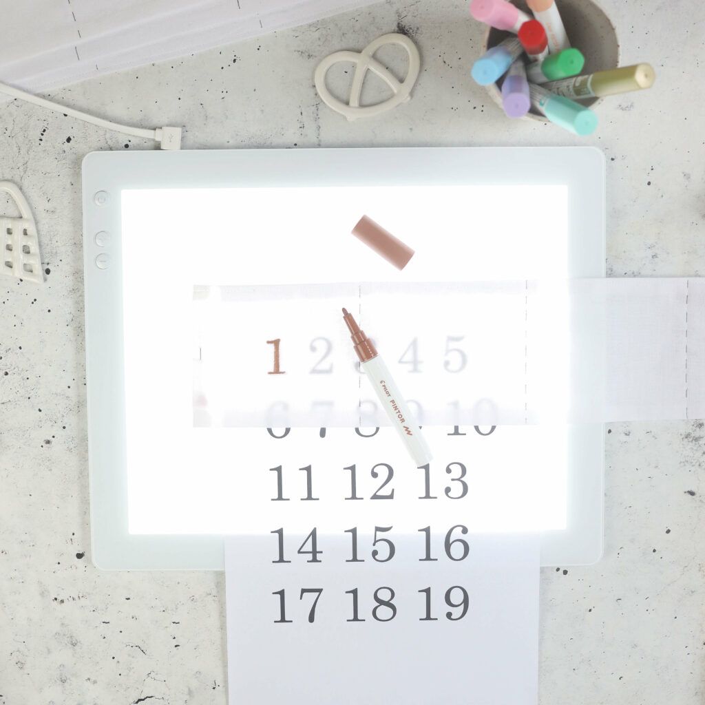 Zahlen auf Taschen übertragen