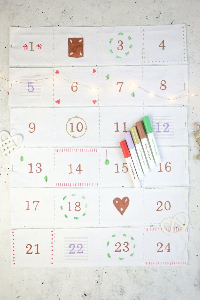 Motive auf Adventskalender mit Taschen aufmalen